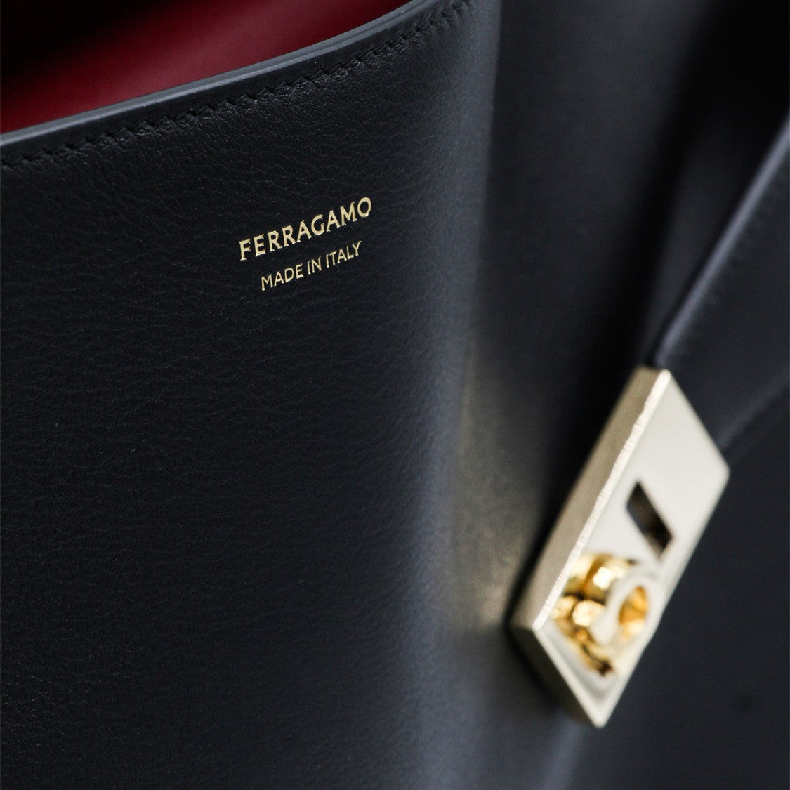 Ferragamo Structured Leather Handbag With Gold Clasps