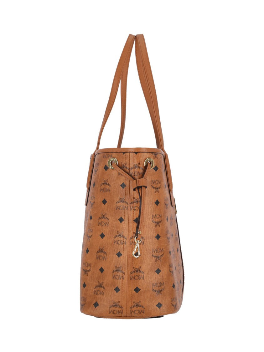 Mcm Structured Brown Bag With Distinctive Logo Pattern