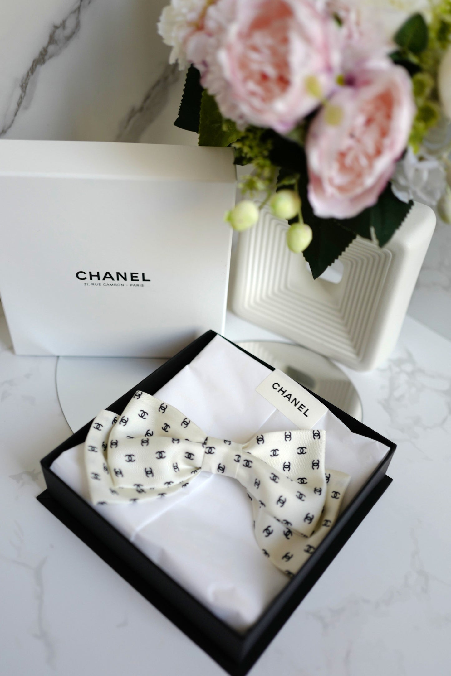 Chanel 2024/2025 Cruise 24C Bow Barrette White with Black CC Print