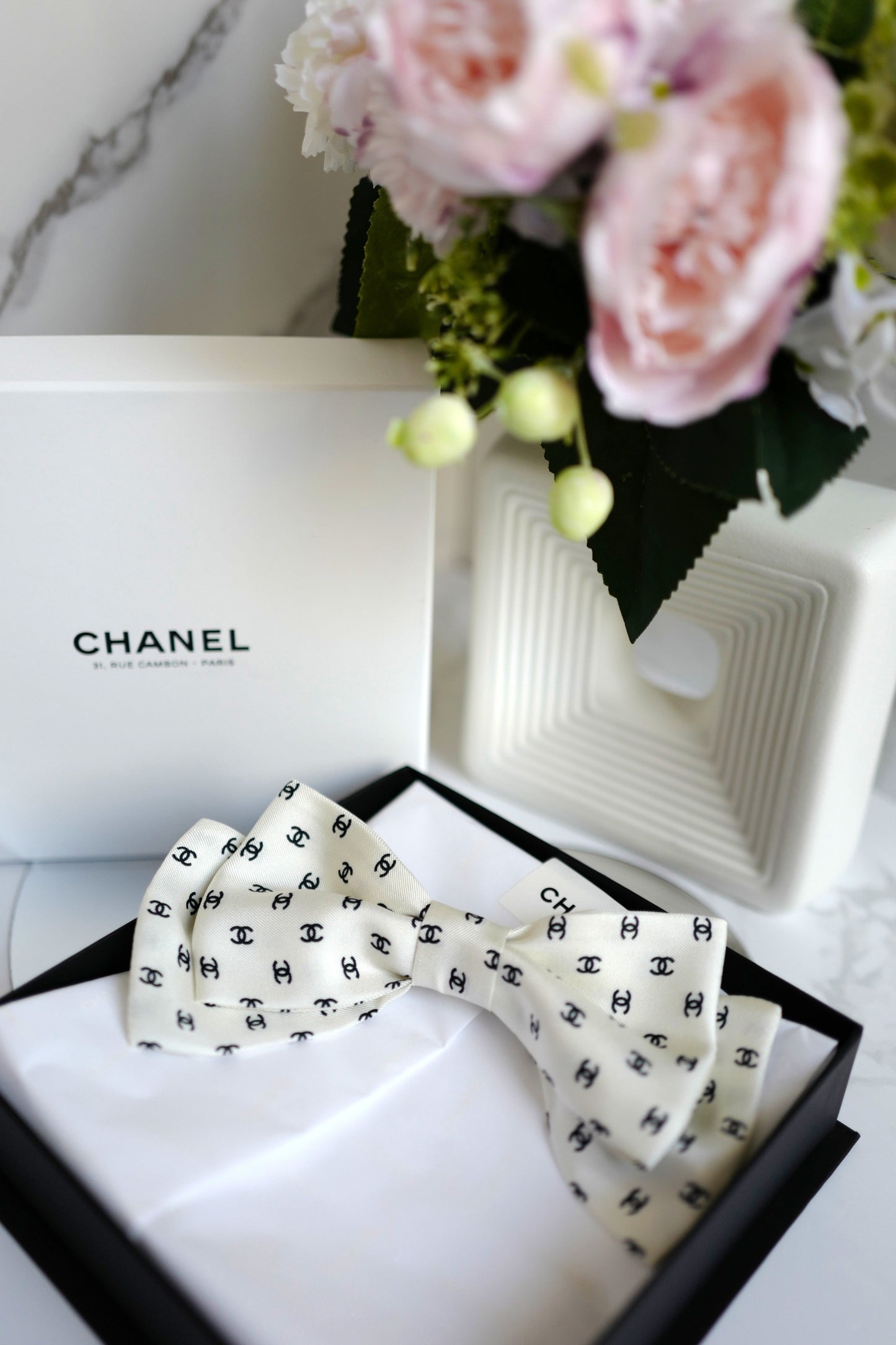 Chanel 2024/2025 Cruise 24C Bow Barrette White with Black CC Print